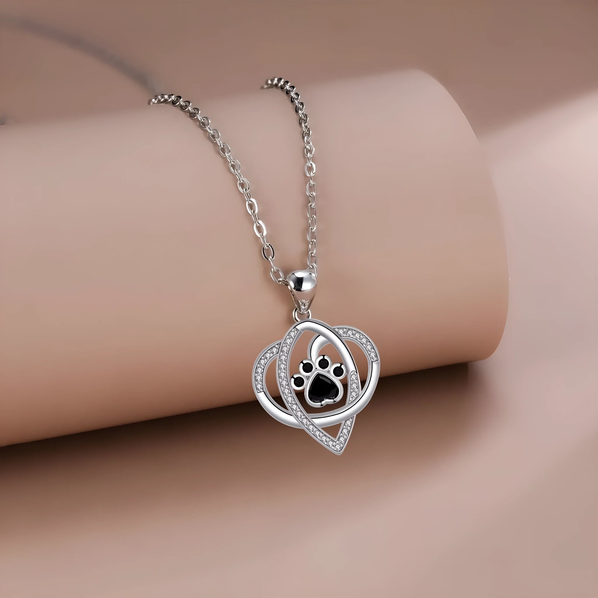 Women's copper necklace with dog paw print pendant and cross chain design