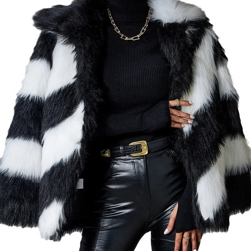 Picture Colour faux fur coat with dark contrast lapels and a matching fur collar.