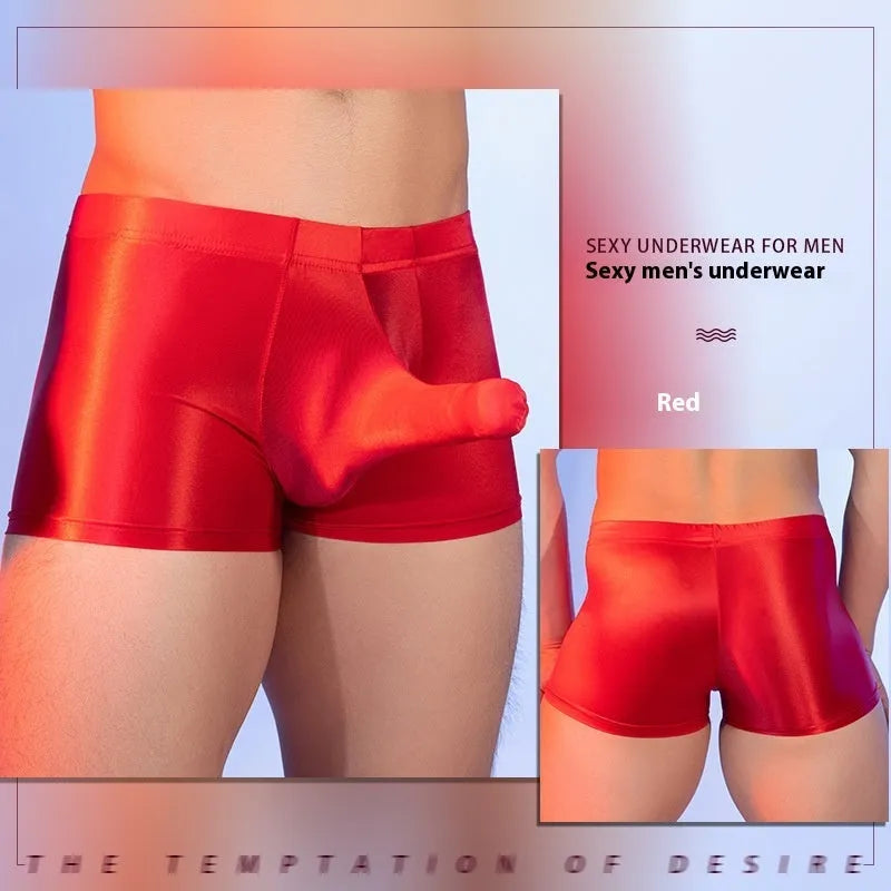 Red men's boxer shorts with elephant nose animal year design, showing mid-waist and seamless construction.