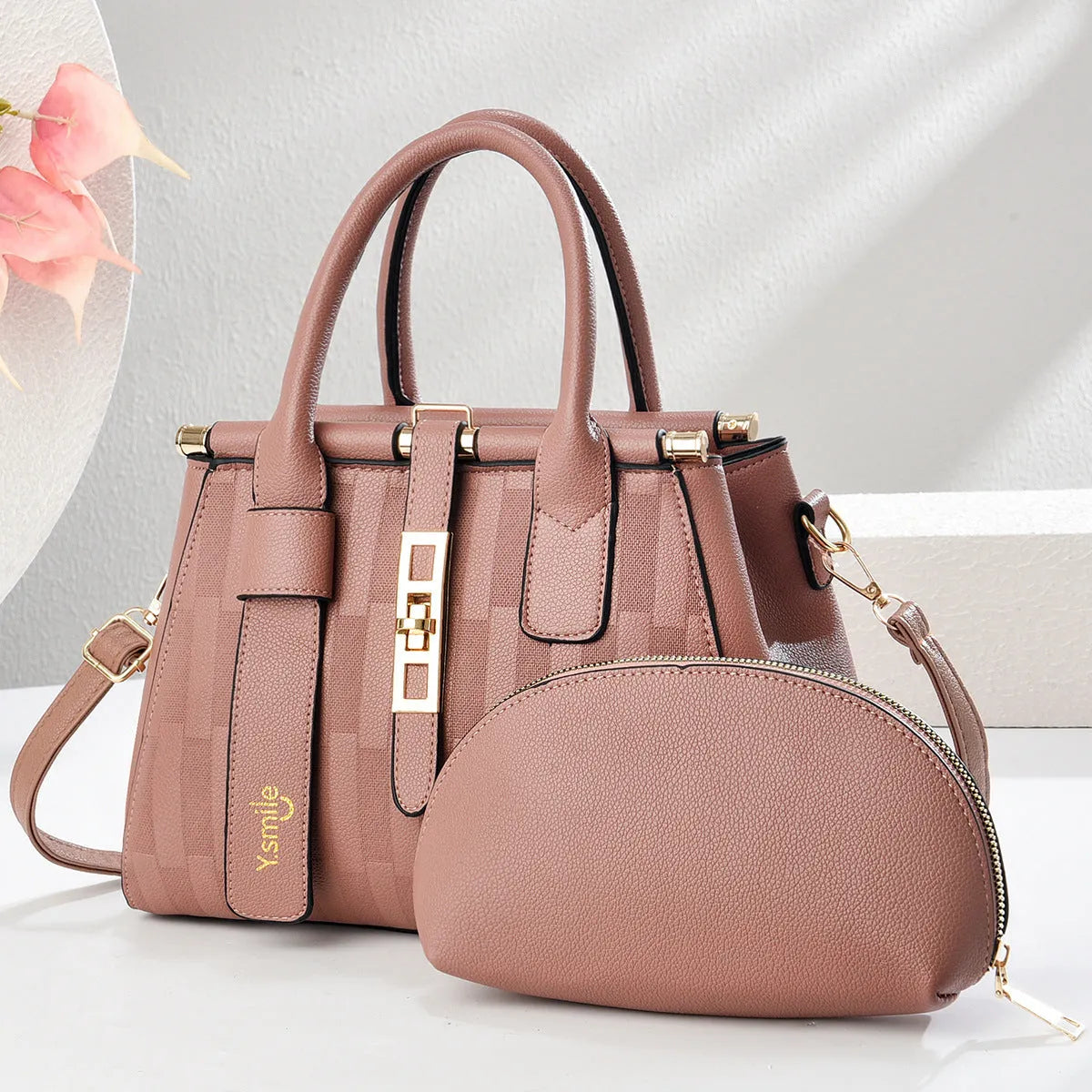 Round black PU leather crossbody shoulder bag showing front and strap.
