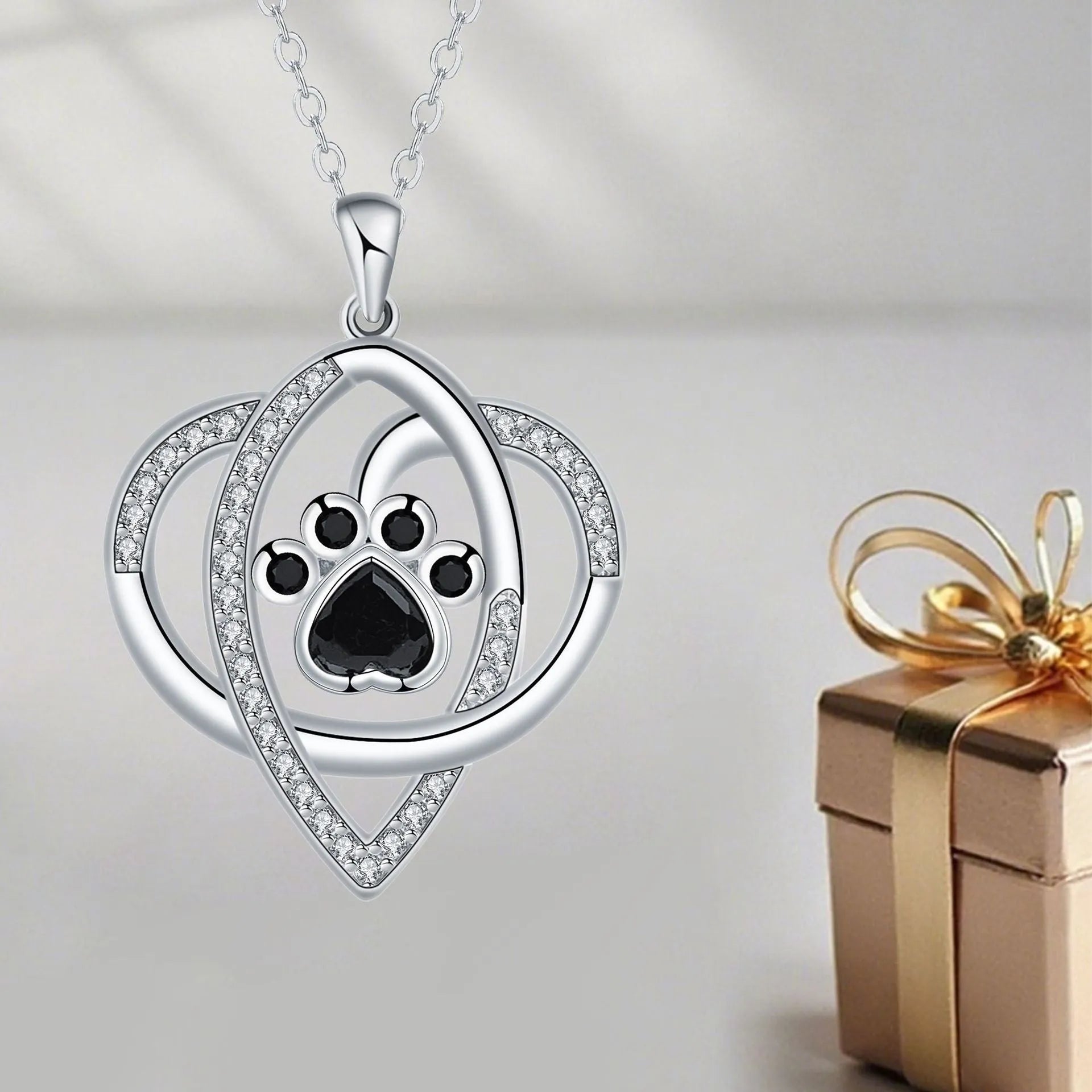 Women's copper necklace with dog paw print pendant and cross chain design