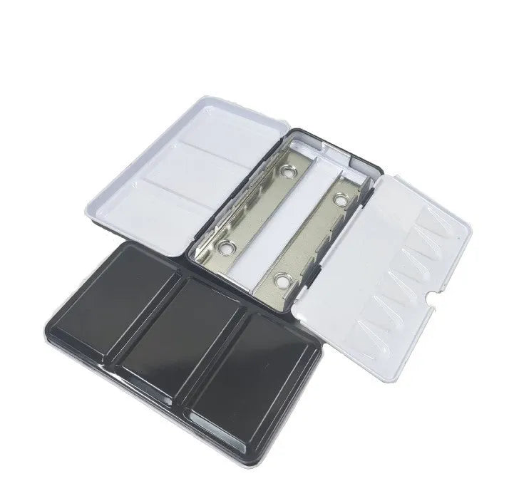 Empty tinplate watercolour paint box shown in three different folding sizes for artist pigments.