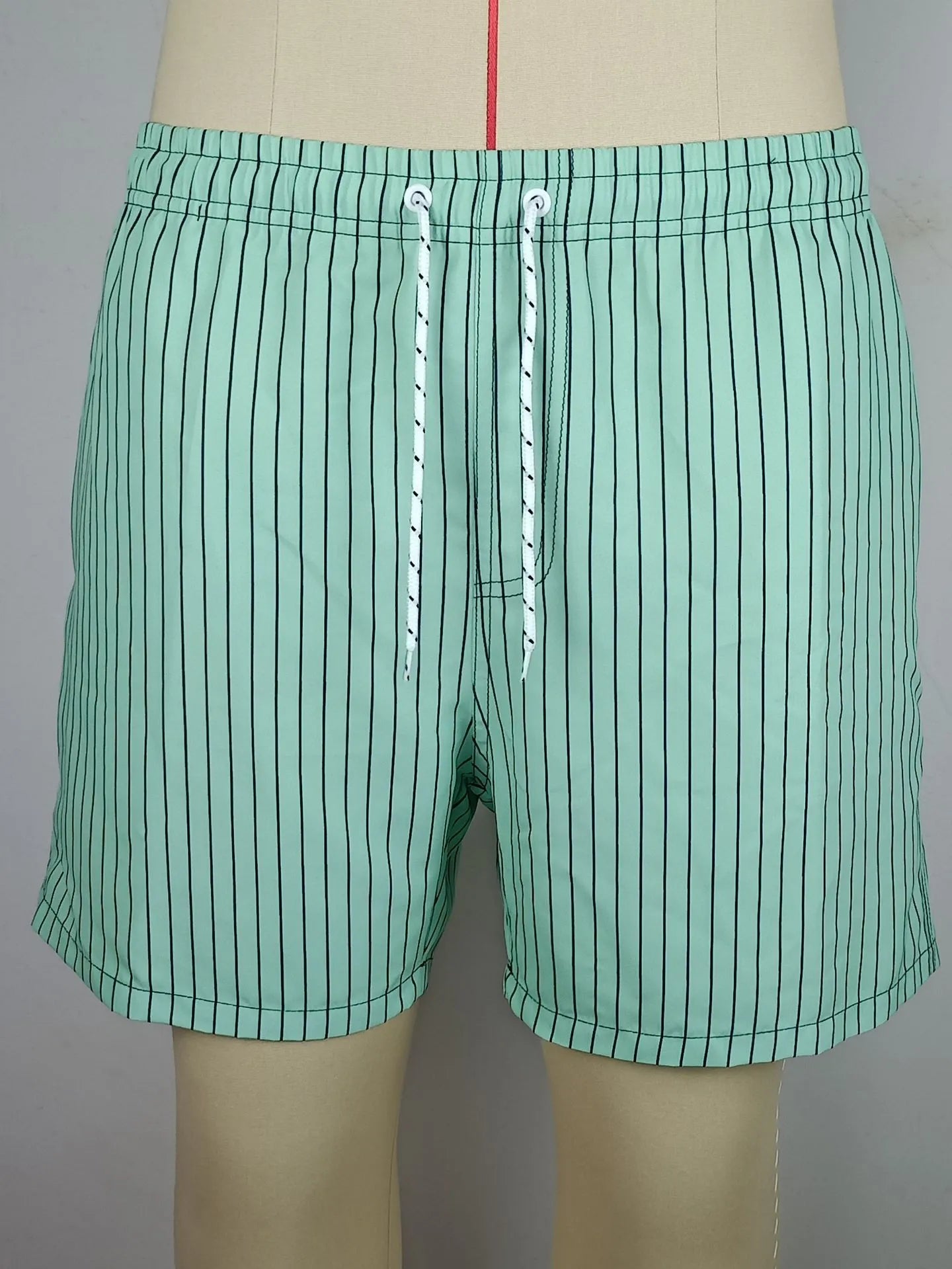 Polyester striped beach shorts with triangle lining pattern in multiple colours