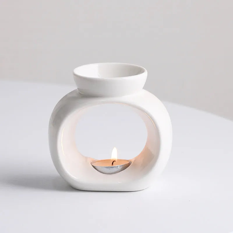 White ceramic Nordic style aromatherapy stove ornament with anti-dry burning design