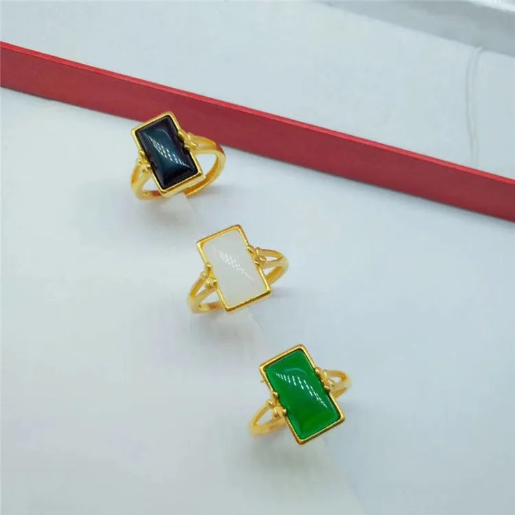 Adjustable brass gold-plated ring with electroplated gemstone in black, green or white options