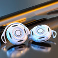 Black and white Bluetooth gaming earphones with hanging ear design and USB charging