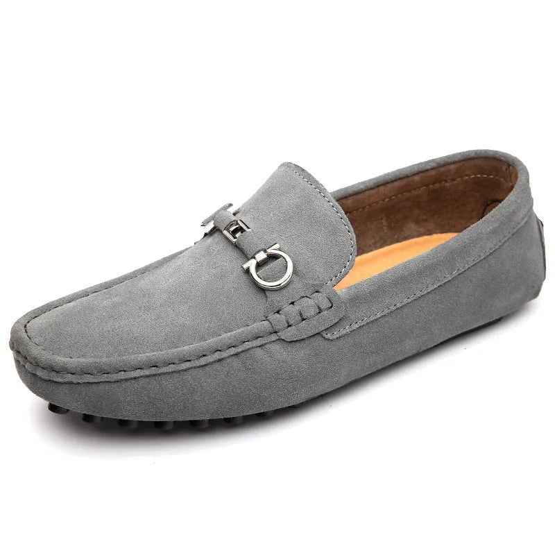 Men's black slip-on cowhide leather shoes with square toe and visible stitching on a rubber sole.
