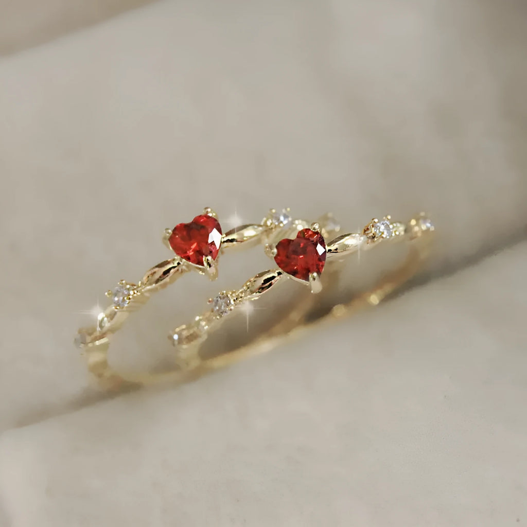 Gold or silver electroplated peach heart fashion ring with zircon stone accents on a copper band.
