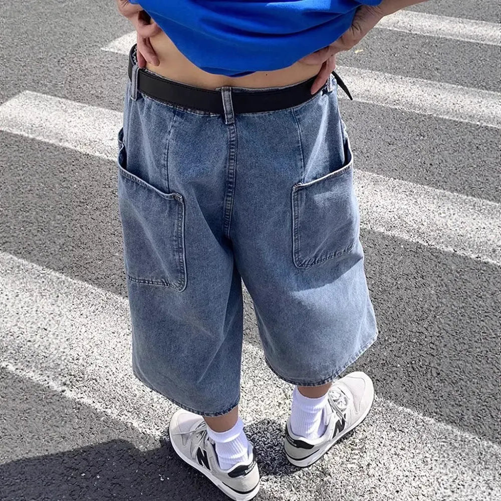 Blue washed denim men's pirate shorts with a high waist and straight legs on a white background.