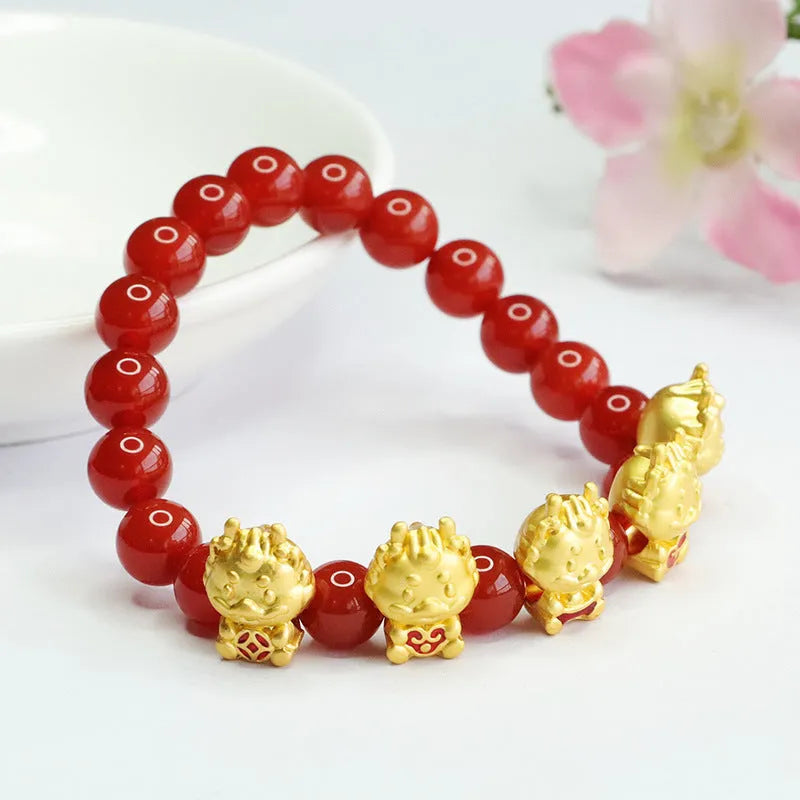 Natural red agate bead bracelet with a detailed five blessings dragon charm on a white background.