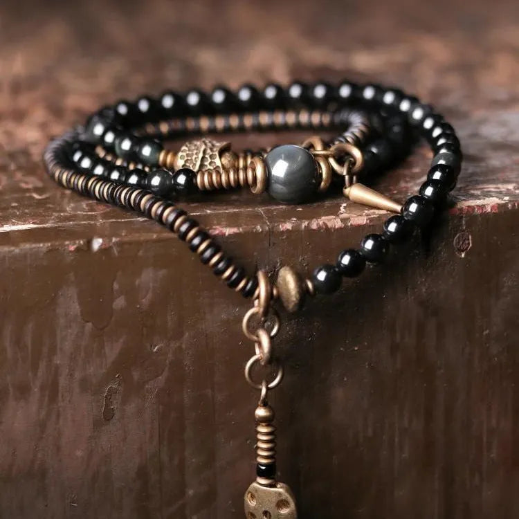 Black geometric multi-layered beaded bracelet with colourful retro beads and adjustable fit