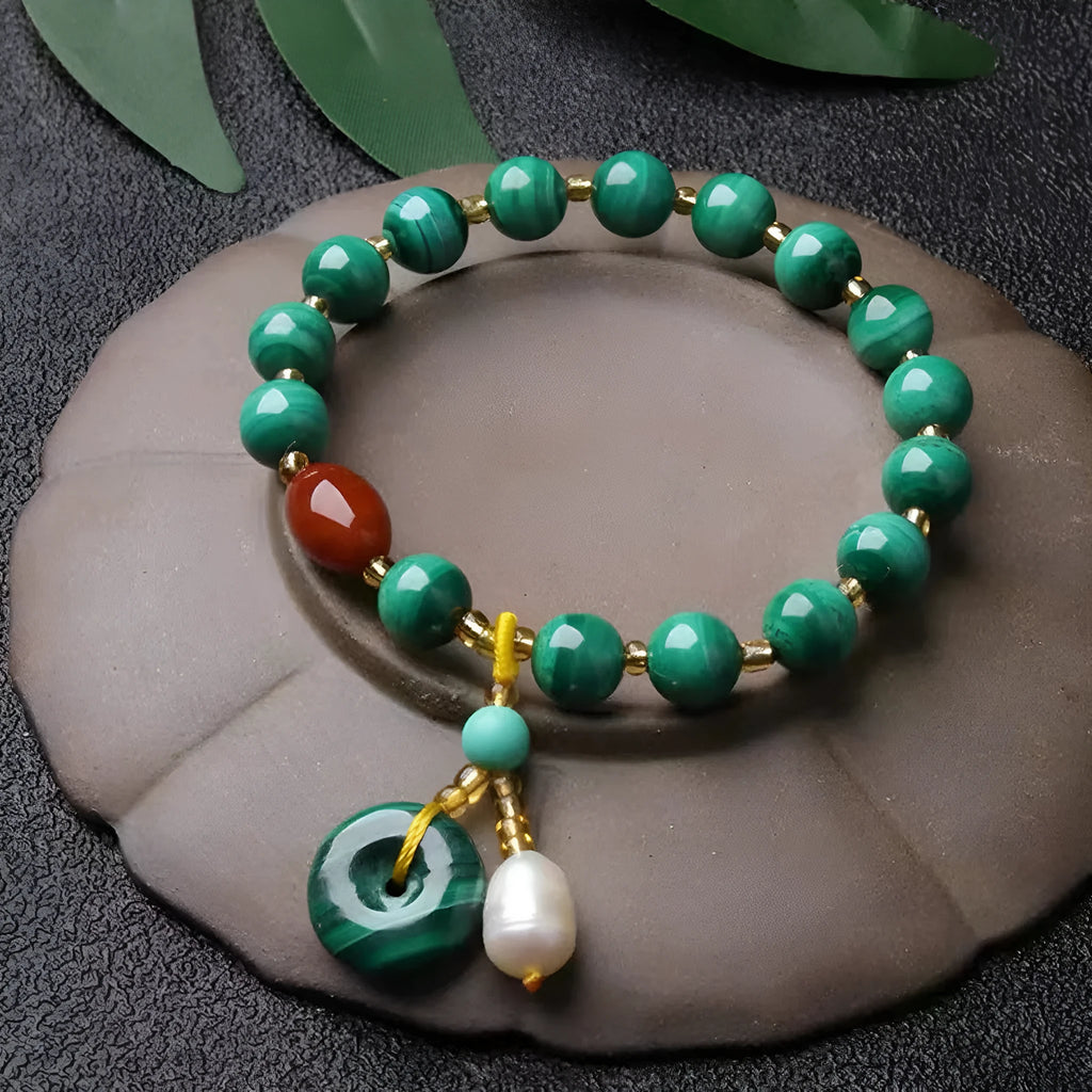 Natural green malachite bracelet with red agate barrel beads measuring 7-8mm