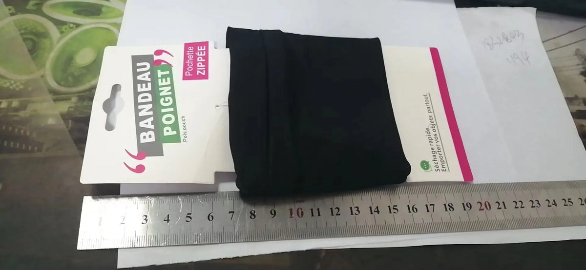 Wrist bag armband sleeve for mobile phone with adjustable strap, shown in packaging