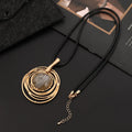 Gold geometric plaid pendant on a snakeskin-textured chain, adjustable sweater necklace.