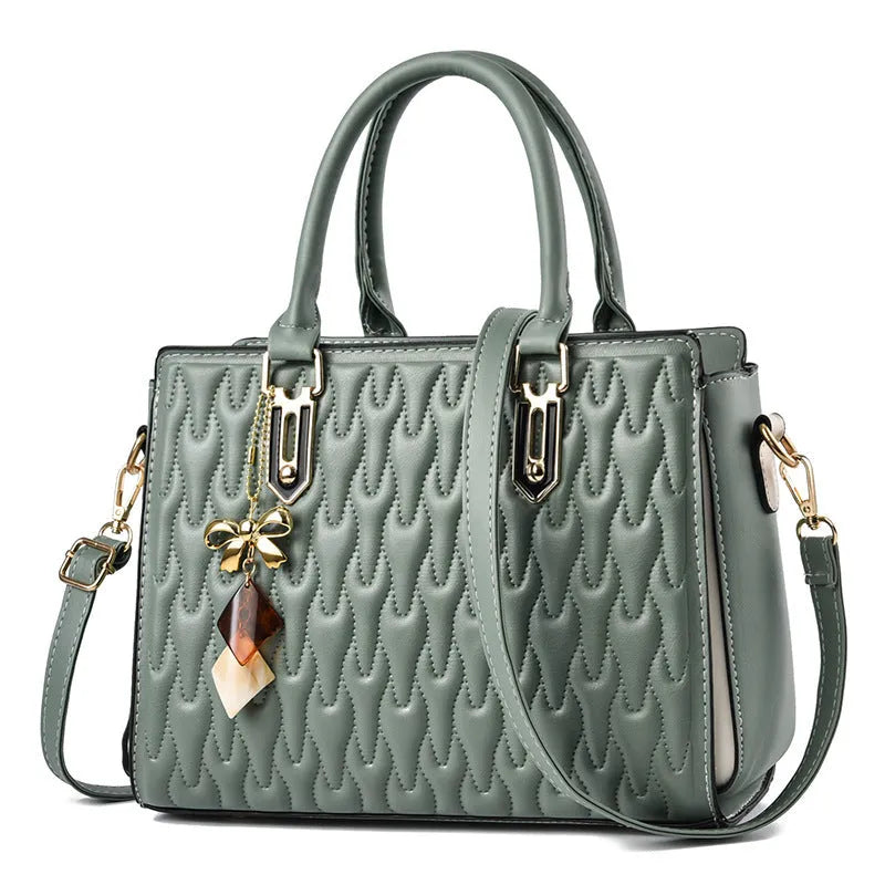 Women's polyester shoulder messenger bag showing large capacity and multiple pocket organisation
