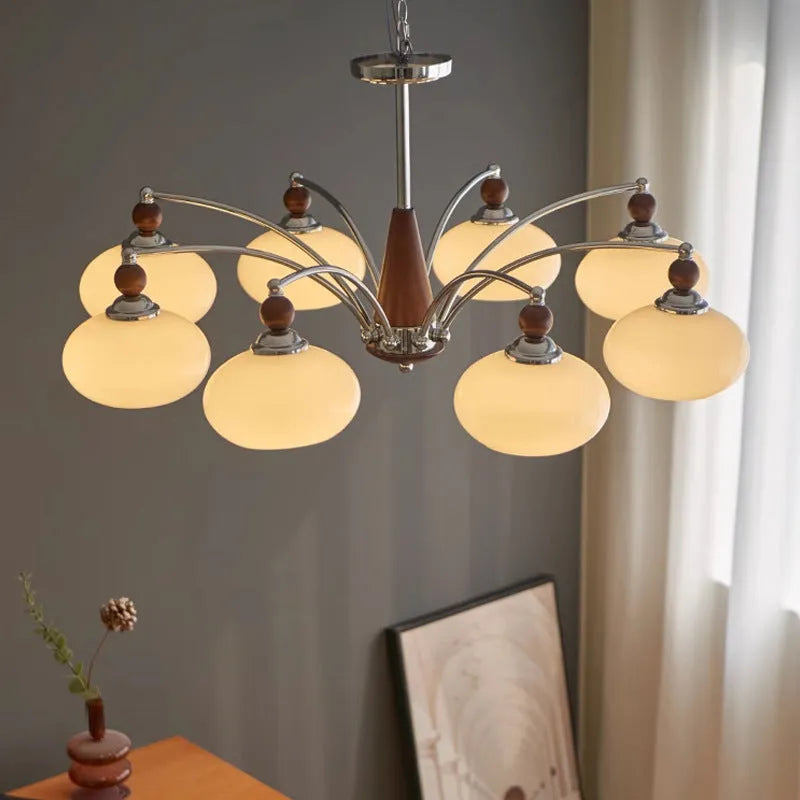 Chrome and persimmon glass chandelier ceiling light with multiple bulbs for dining room.