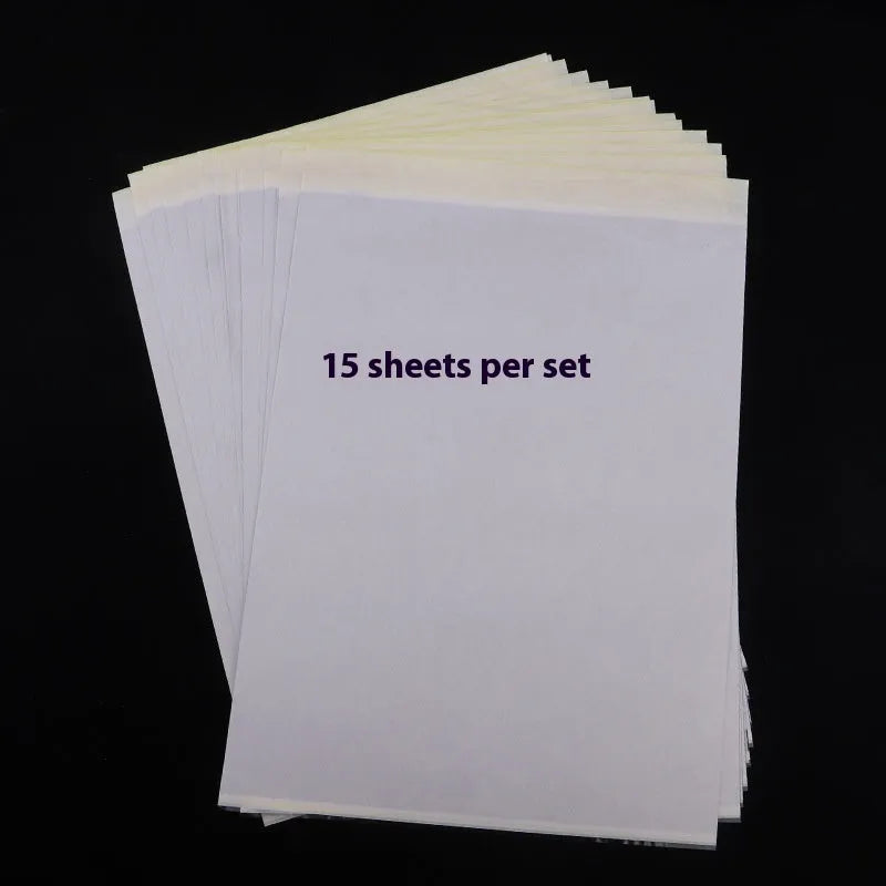 Stack of A4 tattoo transfer paper sheets showing quadruple copy layers for stencil making