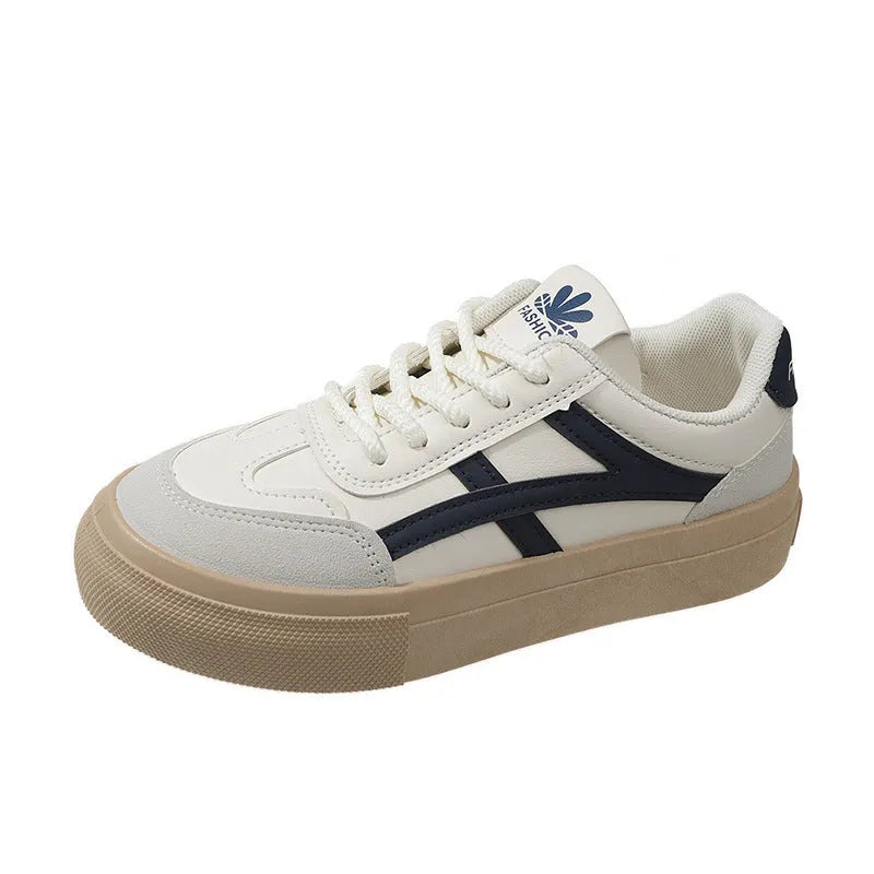 Low-top lace-up board shoes in brown or blue with patent leather-look finish and round toe