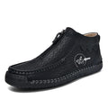 Men's black slip-on loafers with a round toe and rubber sole on a white background.