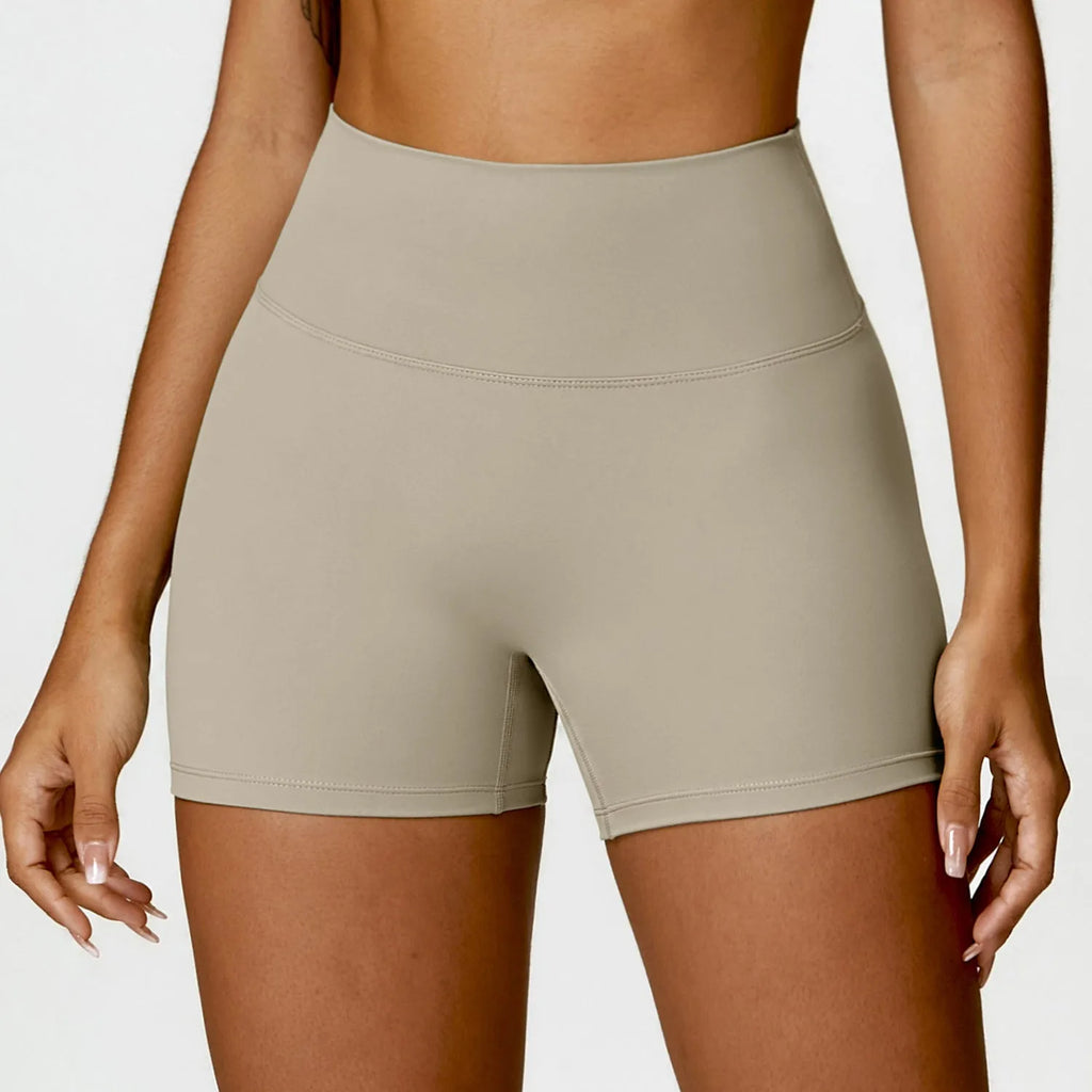 Women's high-waisted nylon yoga shorts in assorted colours on a size chart.