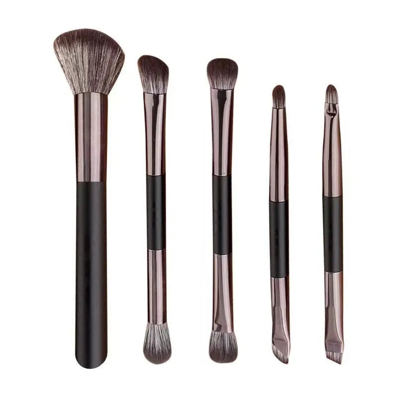 Portable makeup brush set with mirror showing 4 or 5 eyeshadow brushes with artificial fibre bristles