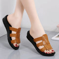Women's flat bottom slippers with waxed leather upper in beige, black, and brown colours