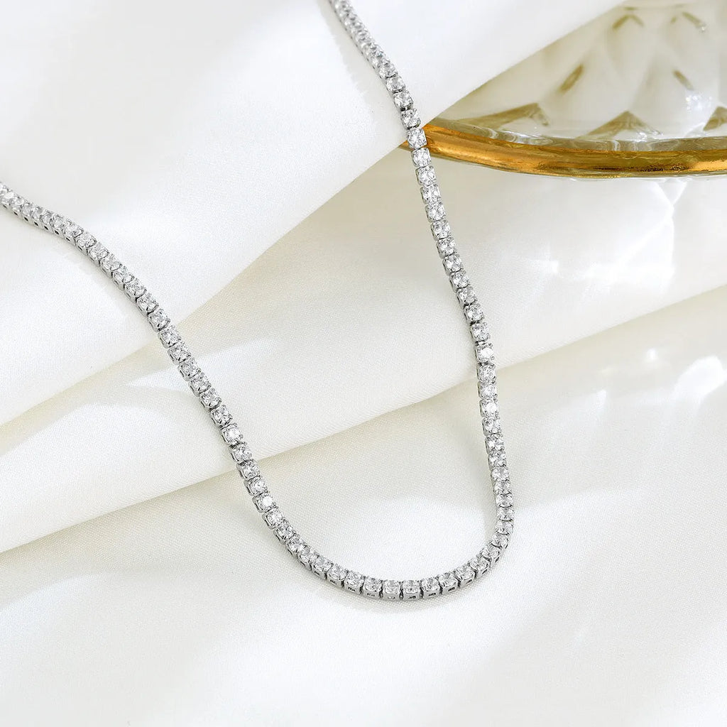 Women's sterling silver necklace with round pendant and diamond-like treatment