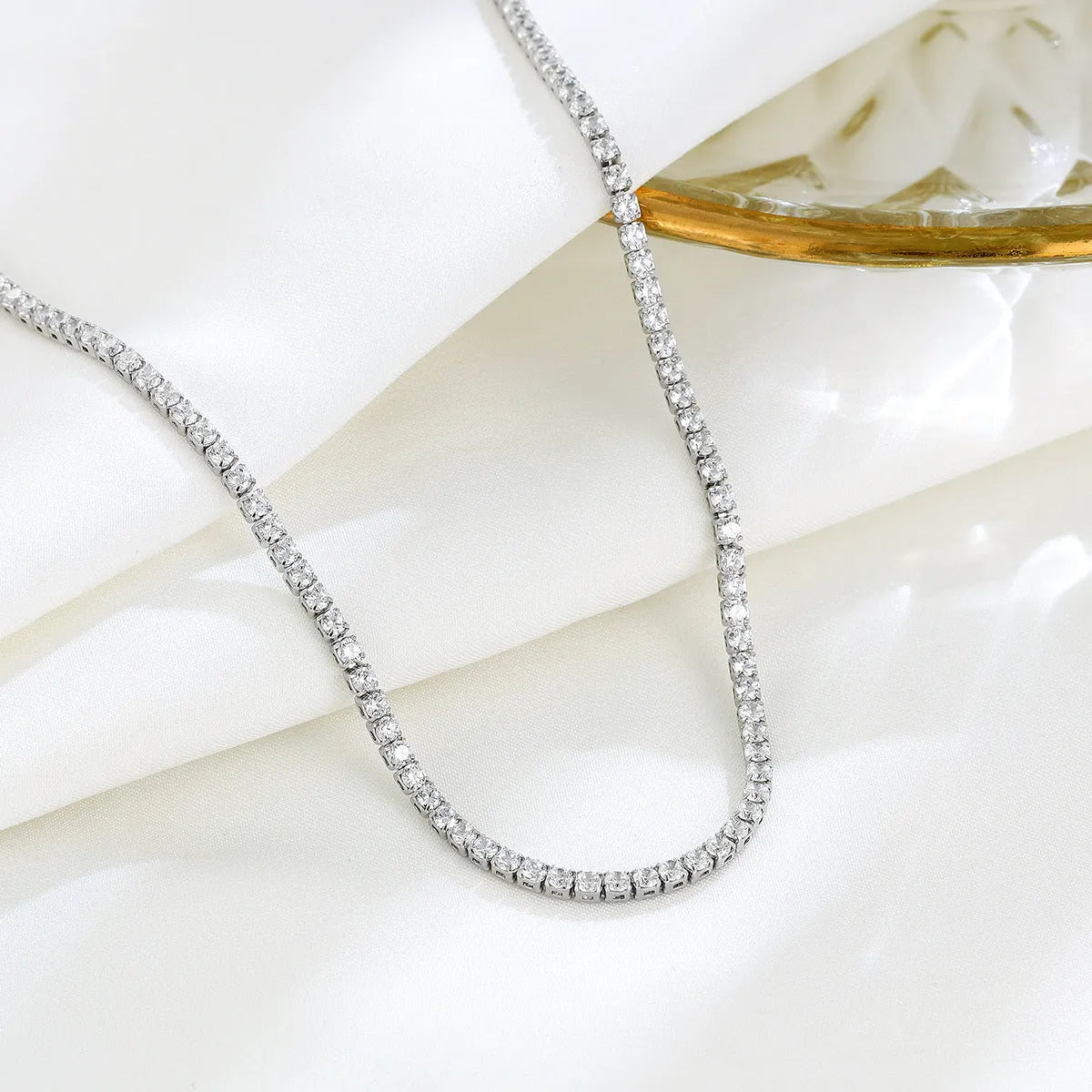 Women's sterling silver necklace with round pendant and diamond-like treatment