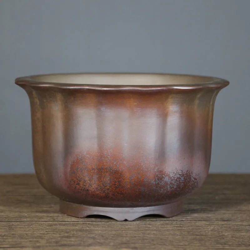Indoor ceramic flower pot with wood burning antique carved design in purple sand clay