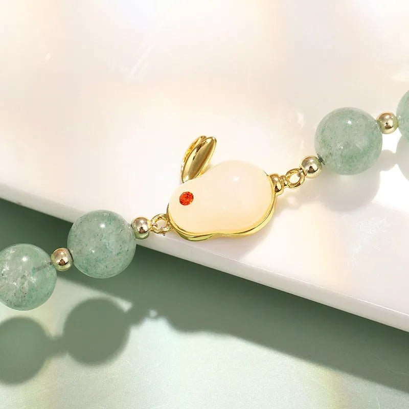 Rabbit charm bracelet with green aventurine or strawberry quartz stones on gold-plated chain