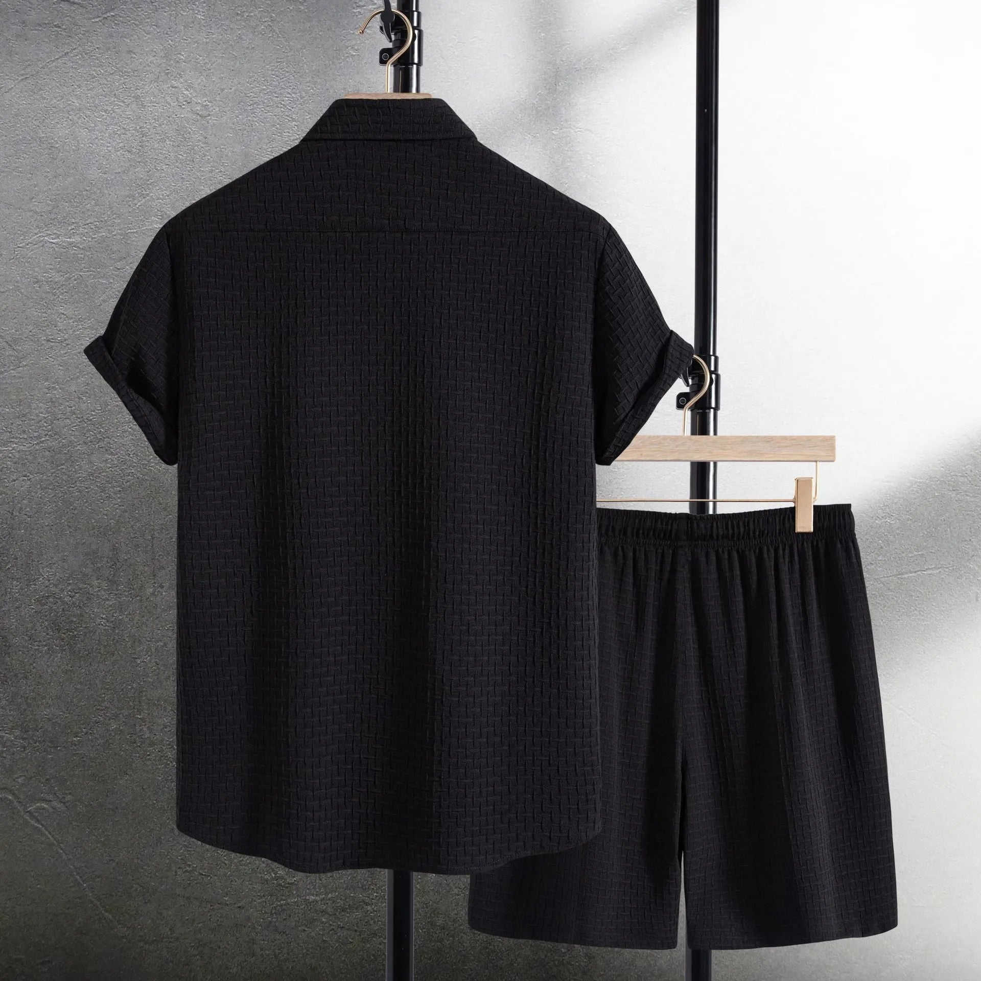 Men's loose fit cotton blend short sleeve shirt and shorts set in white, laid out flat.