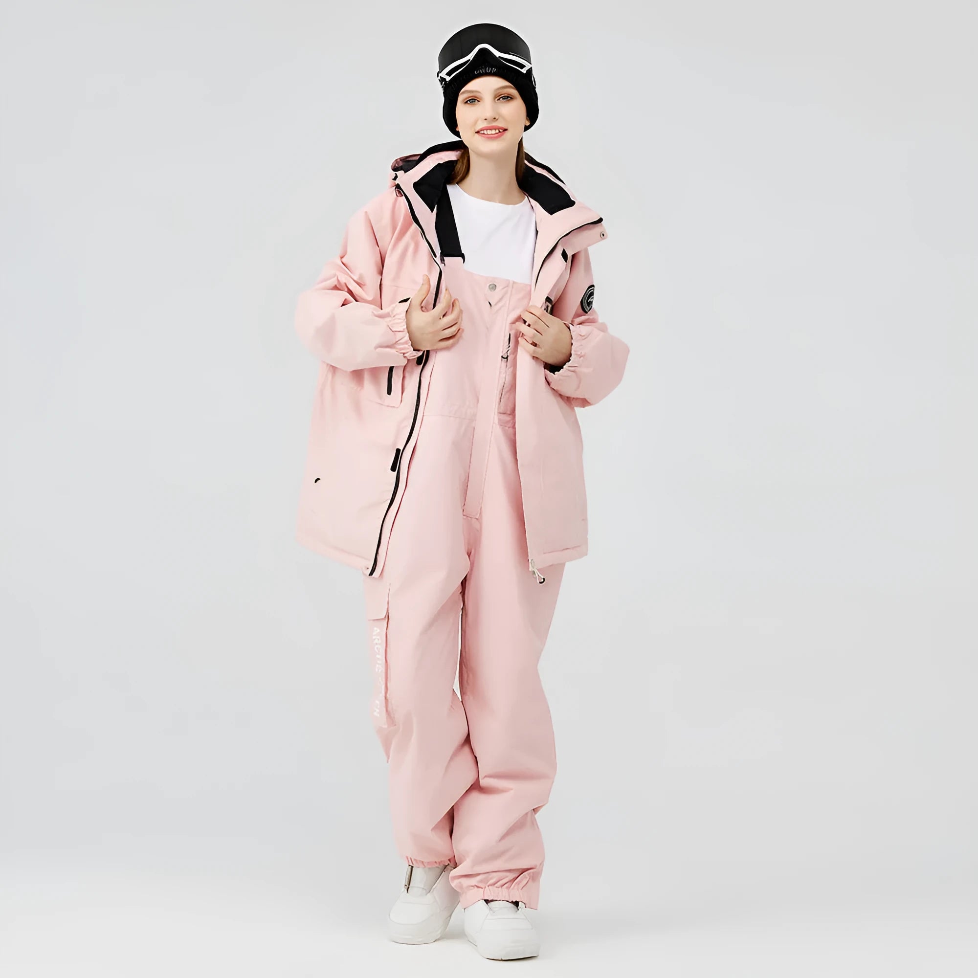 Blue and black unisex winter ski suit jacket and pants for snow sports.