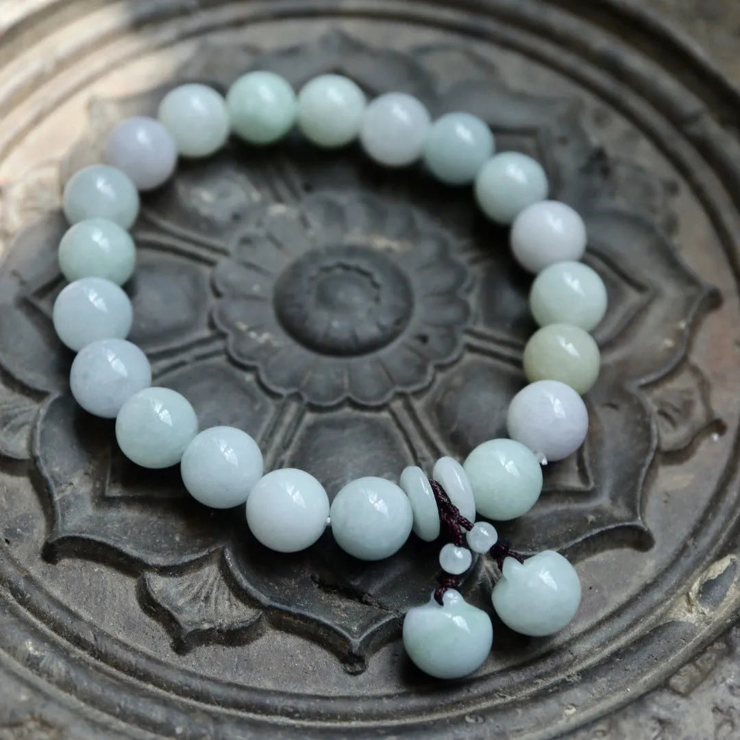 Natural jade bracelet with geometric pendant and hanging charms including Maitreya Buddha, gourd, and double apple designs