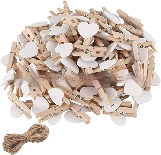 Set of five handmade solid wood heart-shaped clips in various colours