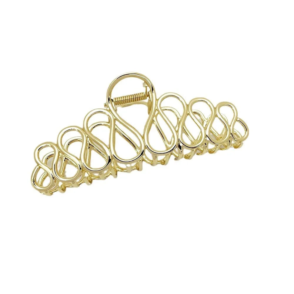 Large minimalist hair clip in gold or silver with tassel detail for updo styling