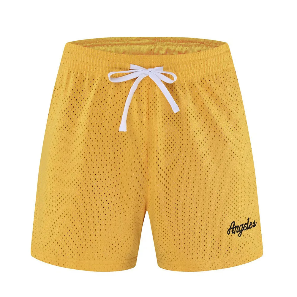 Men's black double-layer mesh sport shorts on a white background