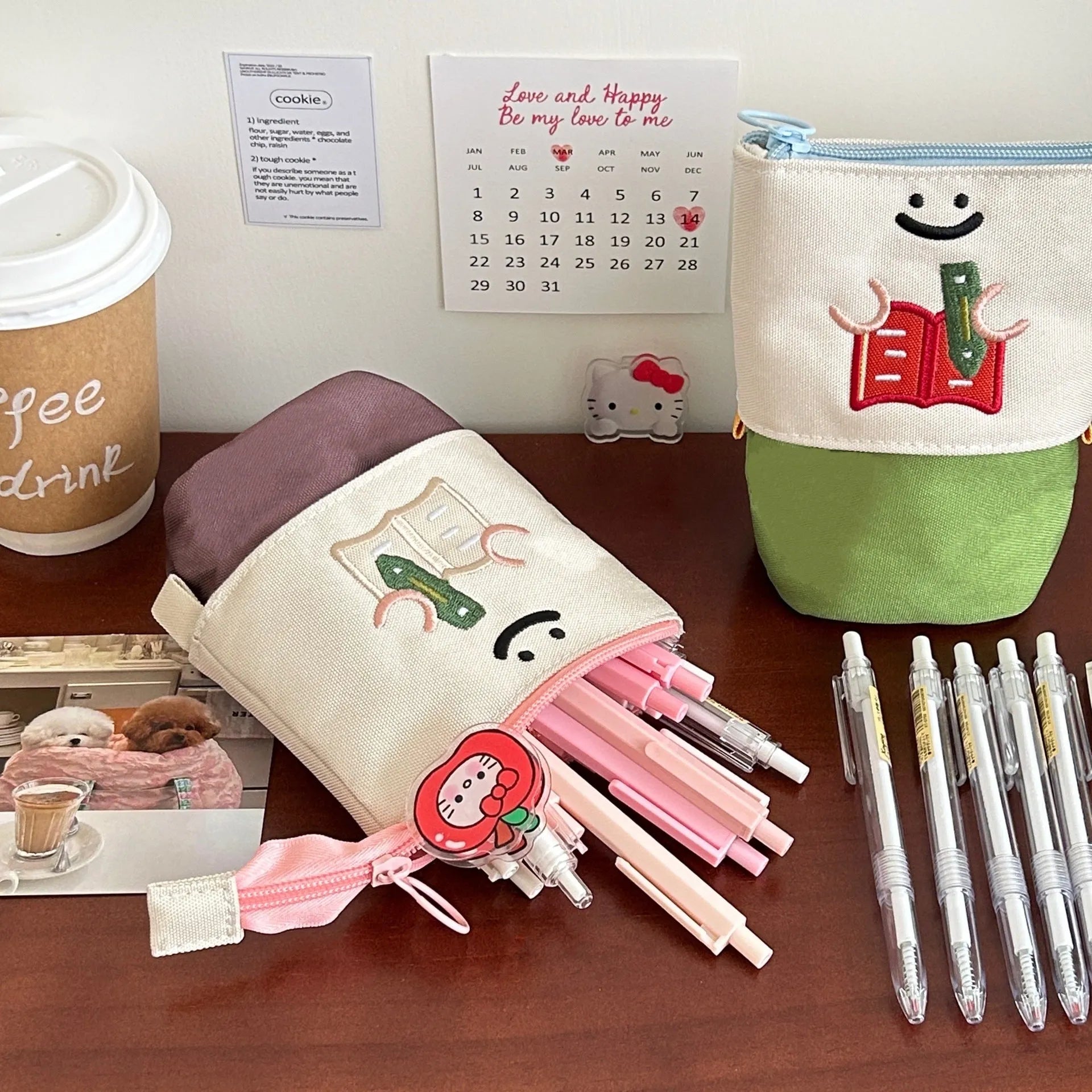 Cartoon design collapsible pencil case in brown or green Oxford fabric, shown open to display large 17cm x 14cm storage capacity.