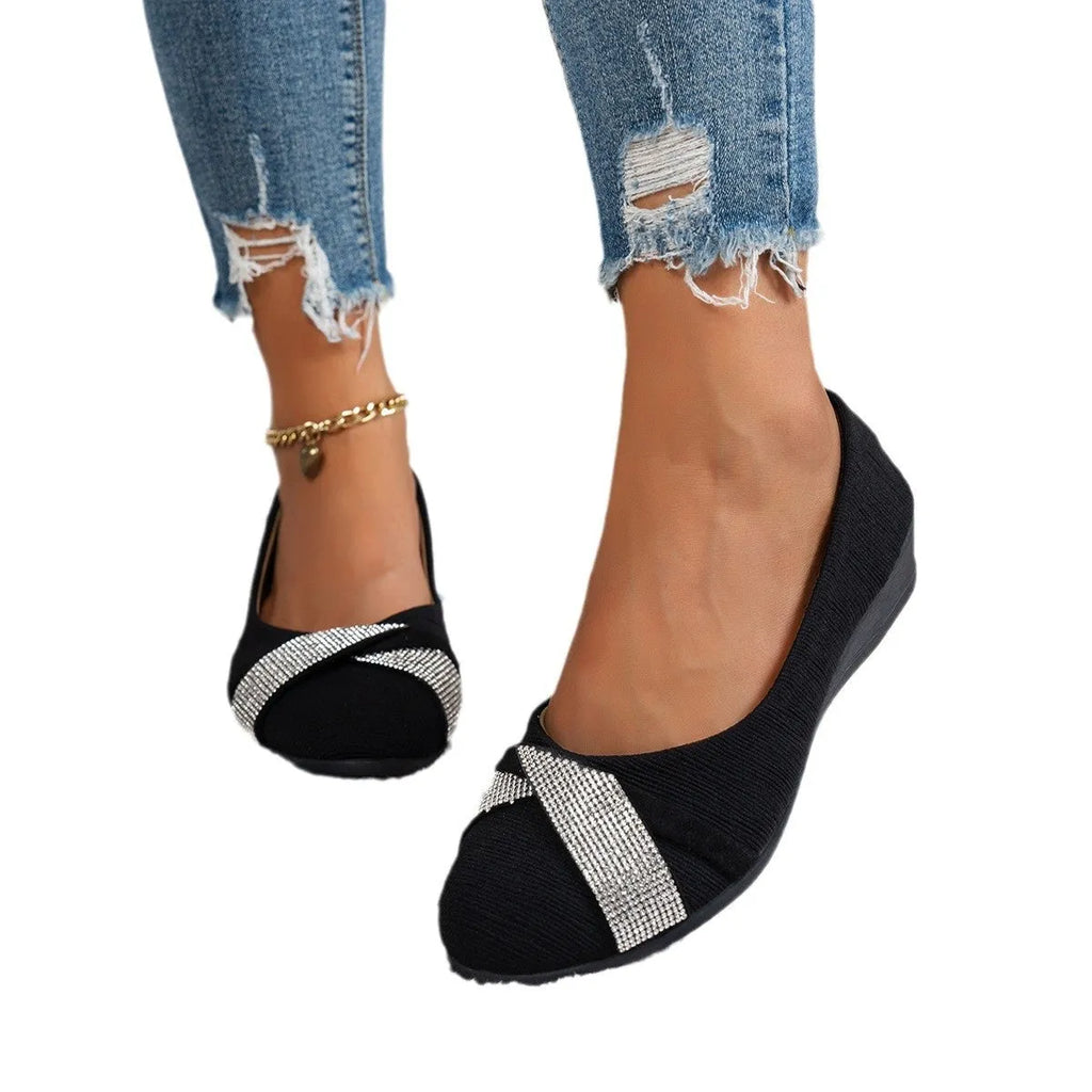 Black women's slip-on casual shoes with rhinestone decoration and a chunky heel.
