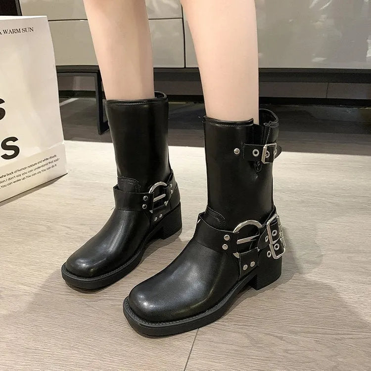 Women's black platform boots with buckle detailing and mid-calf length