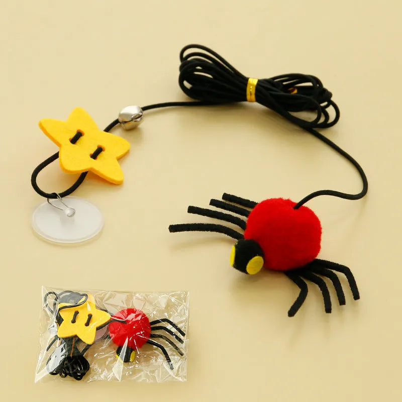 Red cat door hanging toy with swinging elastic rope, feather attachment, and bell spider
