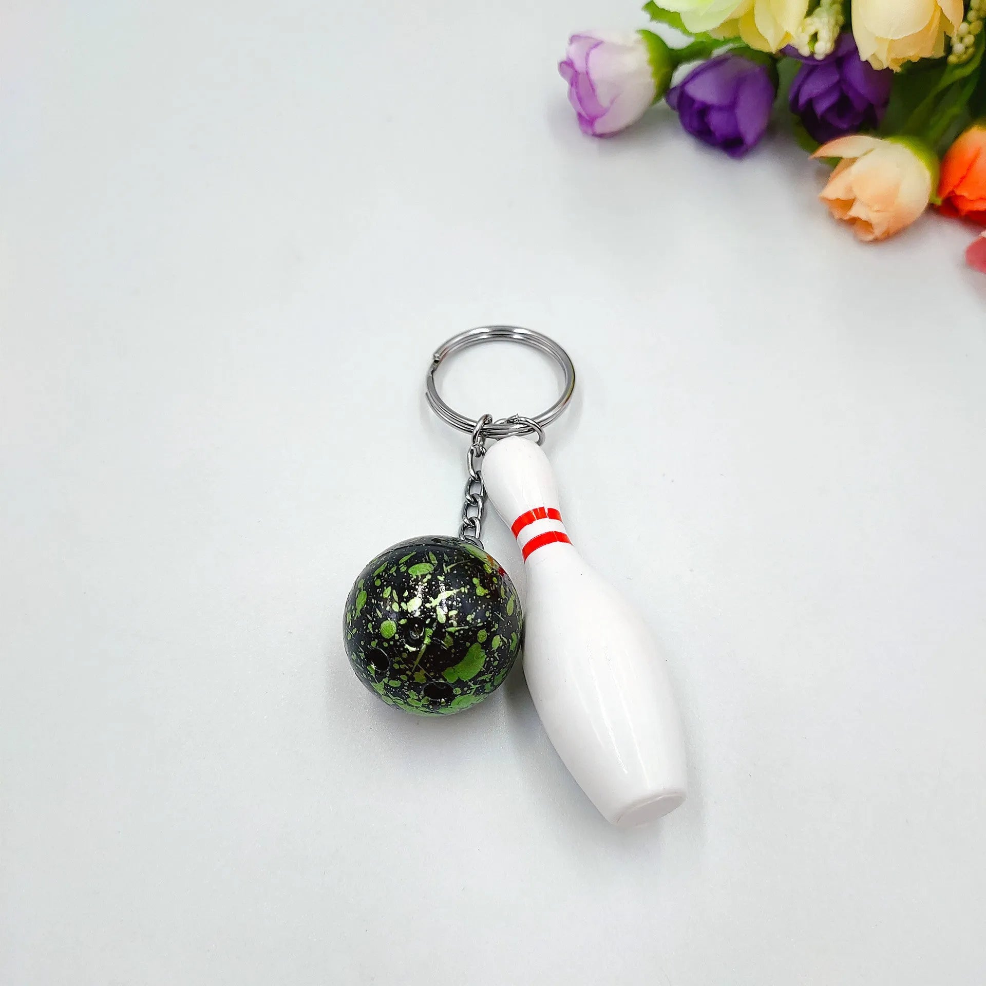 Mini bowling pin simulation keychain pendant in blue colour with metal keyring attachment