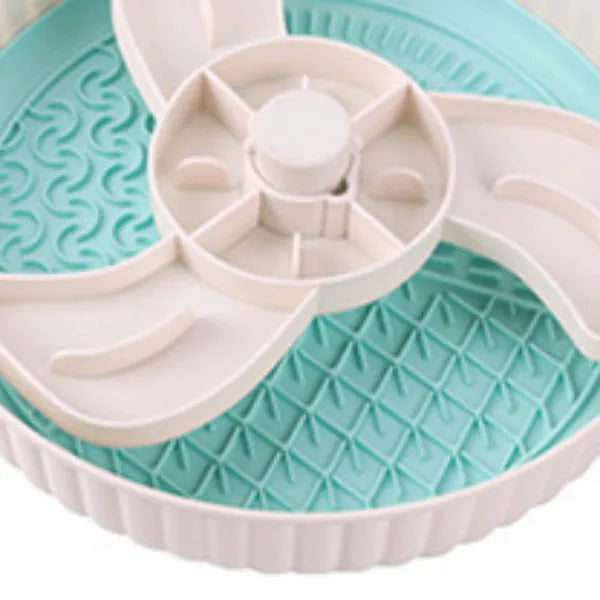 Pet slow feeder bowl with silicone licking mat in rotating game board design