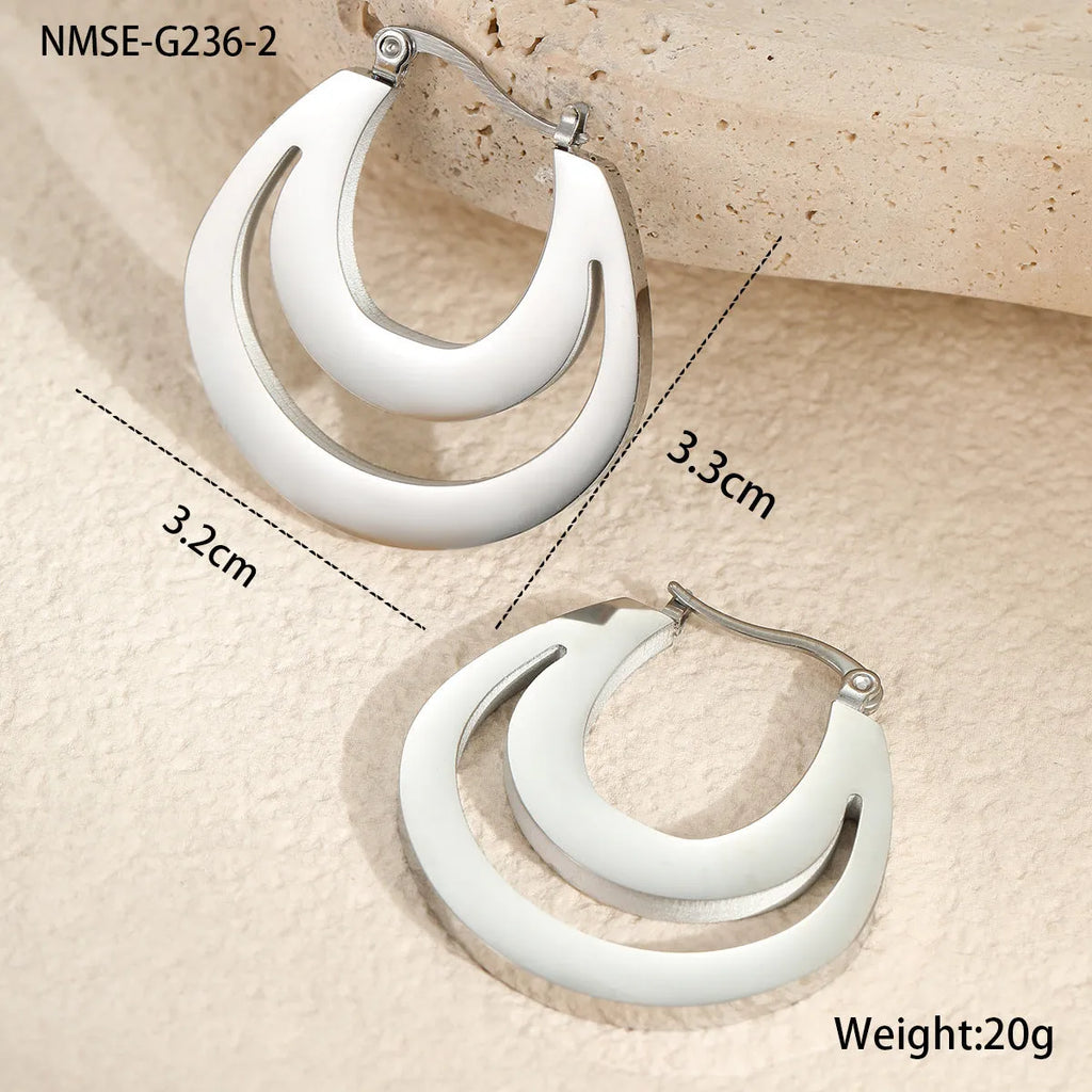 Geometric minimalist French earrings in gold or steel finish with round ring design elements