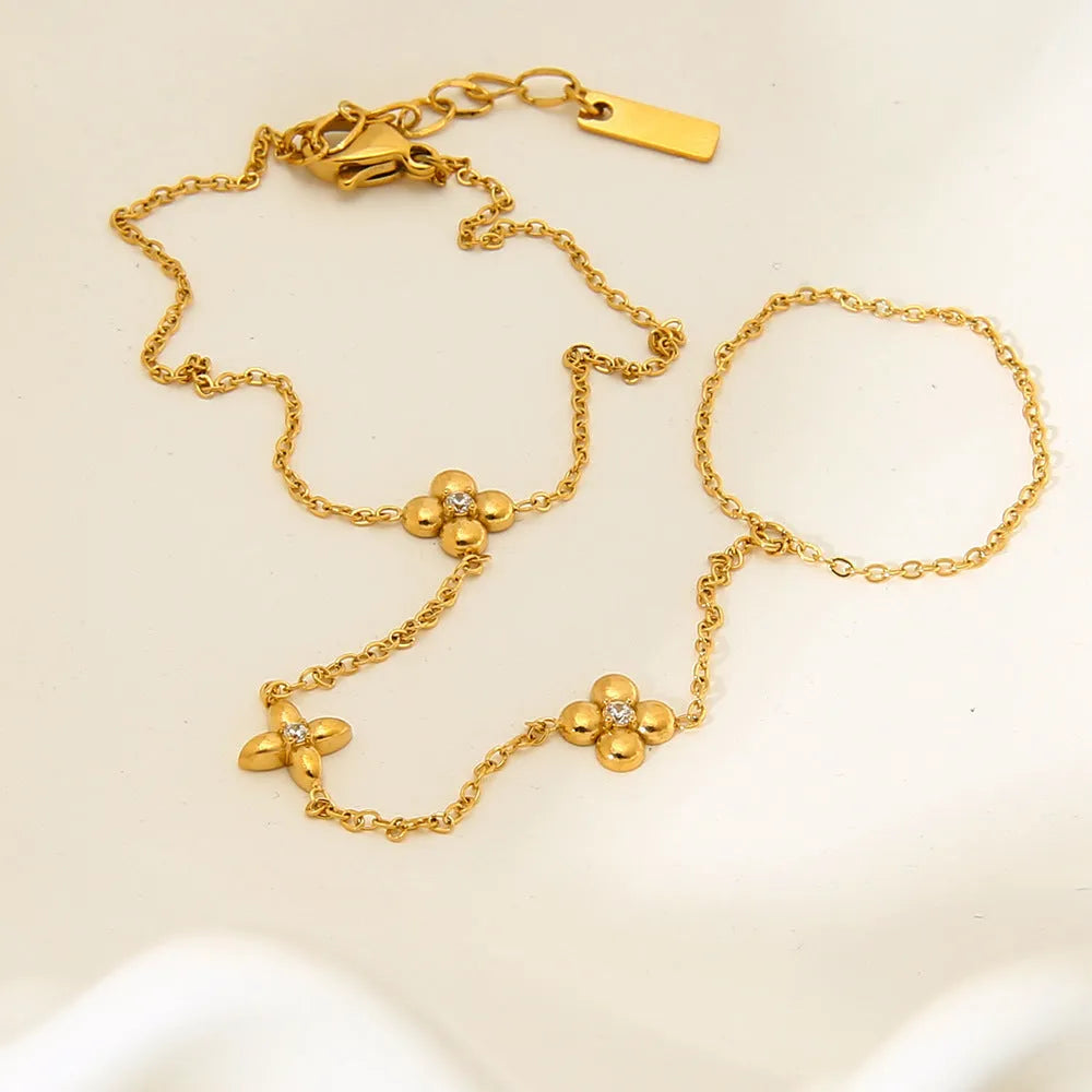 Women's gold stainless steel bracelet with geometric flower and eight-pointed star design