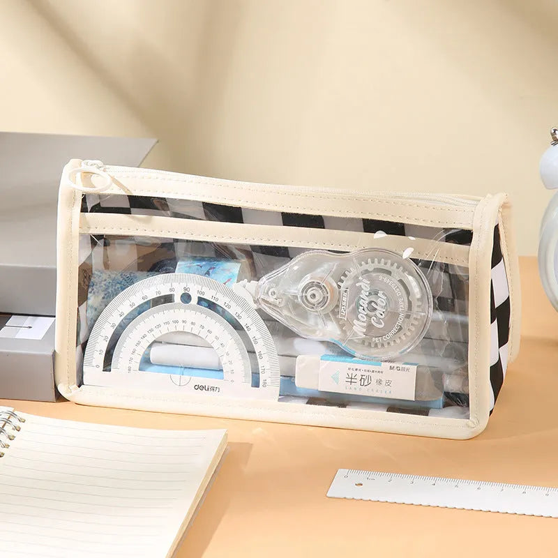 Transparent PVC pencil case with chessboard pattern showing pens inside, dimensions 21.5x8x11.5cm