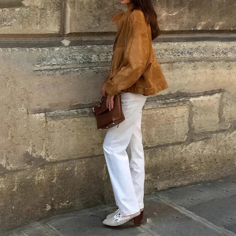Solid colour loose-fit polyester jacket with long sleeves on a hanger
