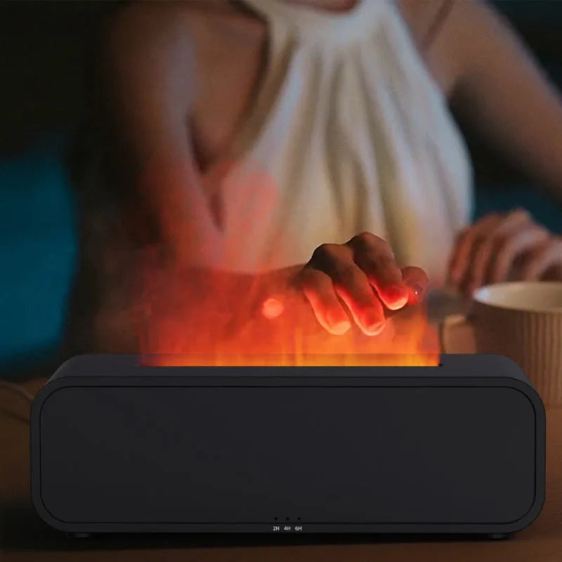 Black and white aroma diffuser with colour-changing LEDs, remote control, and USB cable.