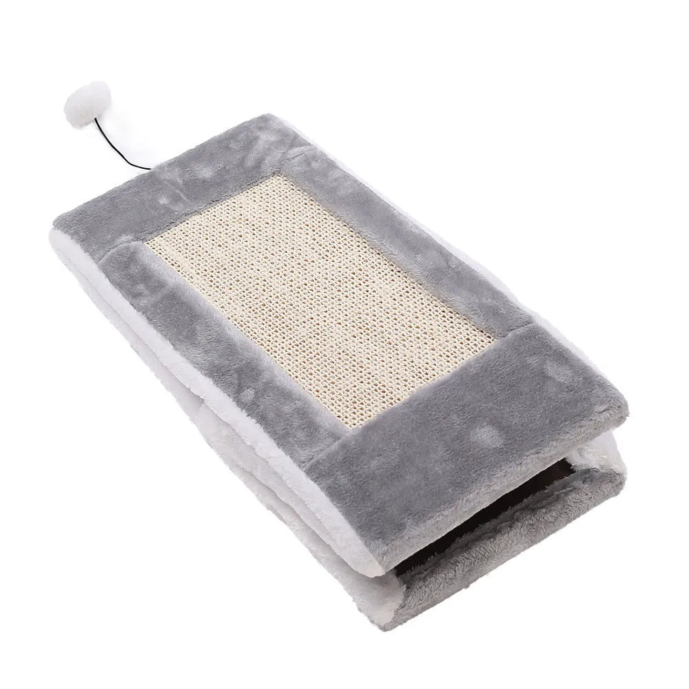 Triangular grey and white cat bed with sisal scratching posts on the sides.