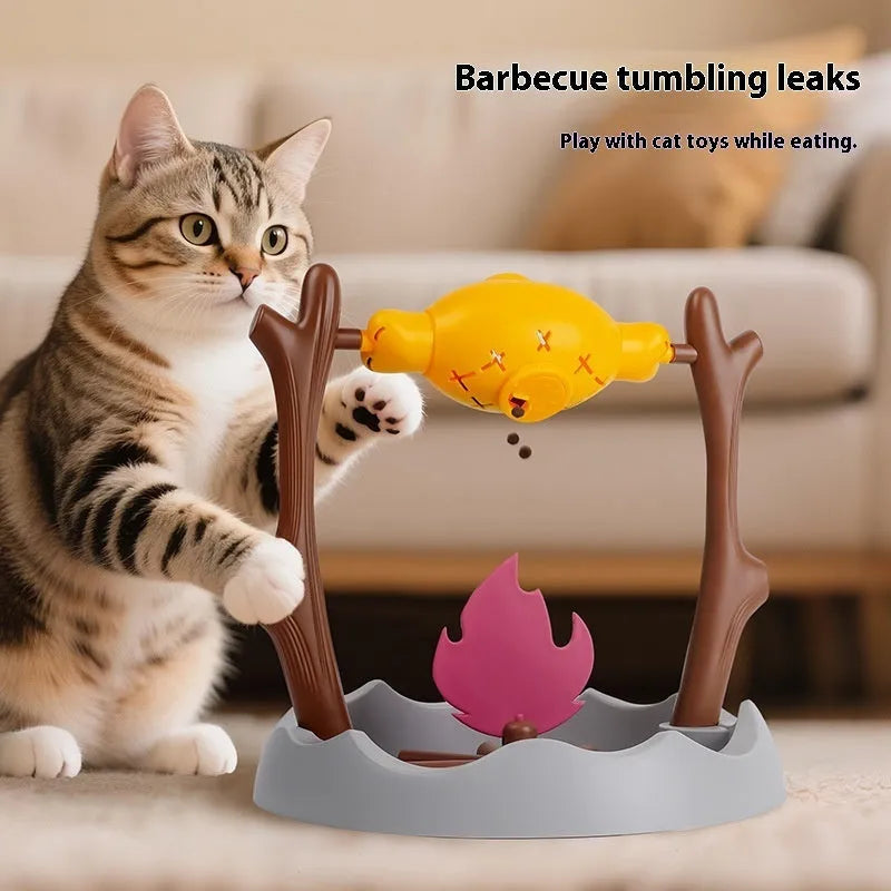 Barbecue-style plastic cat tumbling food feeder toy with multiple openings for treat dispensing