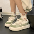 Green women's flat casual shoes with PU mesh upper and round toe on a non-slip sole.